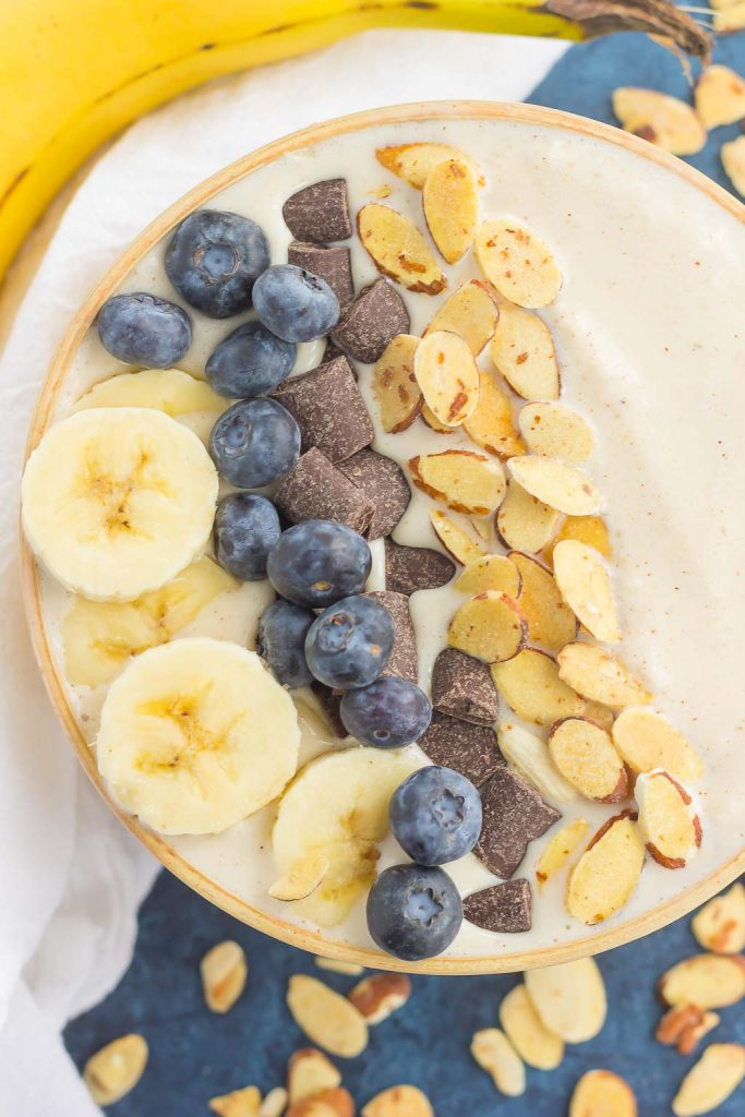 overhead view of a banana smoothie bowl with toppings