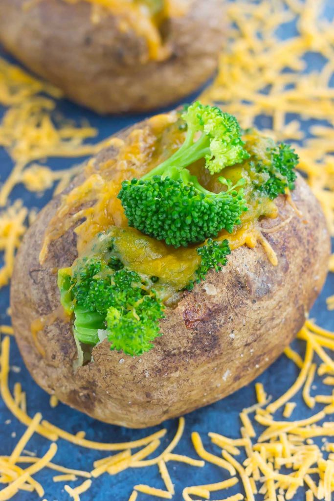 Seasoned potatoes are baked until soft and fluffy on the inside and crisp on the outside. Topped with fresh broccoli and a sprinkling of cheddar cheese, these Broccoli Cheddar Stuffed Baked Potatoes make deliciously easy meal or side dish! #bakedpotatoes #bakedpotatorecipe #stuffedpotatoes #stuffedbakedpotatoes #broccoli $broccolibakedpotatoes #cheddarstuffedpotatoes #sidedish