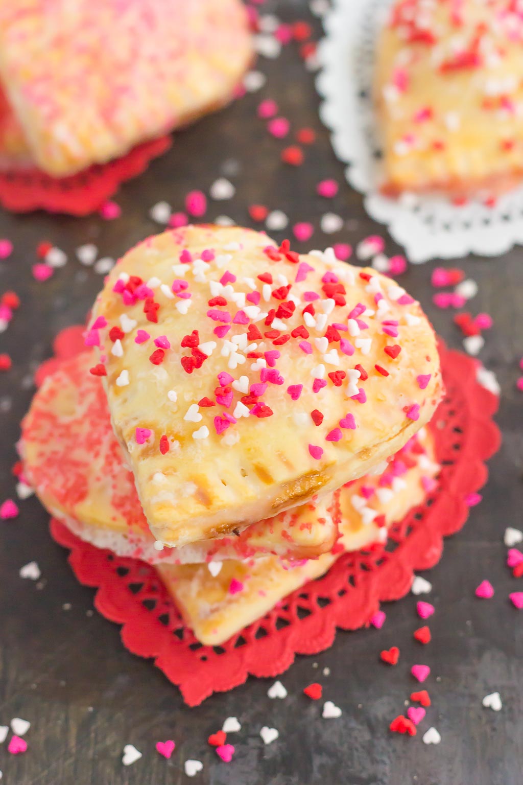 These Mini Strawberry Heart Pies are the perfect dessert for spoiling your sweetie on Valentine's Day or for entertaining those party guests. A pre-made pie crust is cut into the shape of hearts and then filled with sweet strawberry jam. It's an impressive treat that looks time-consuming but is so easy to make!