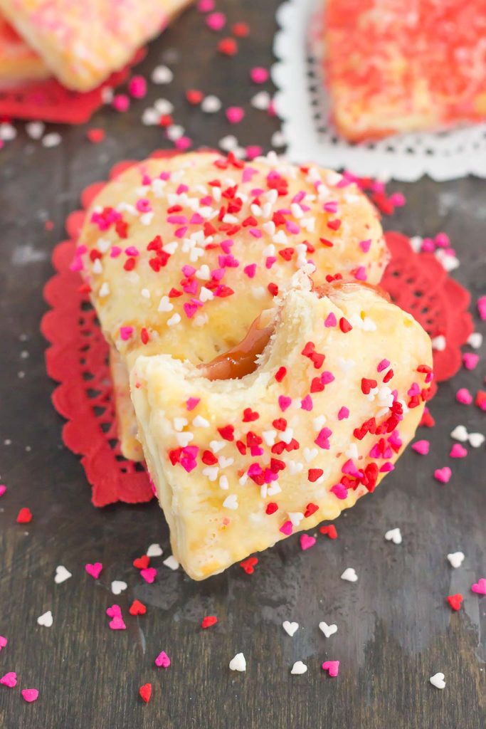 These Mini Strawberry Heart Pies are the perfect dessert for spoiling your sweetie on Valentine's Day or for entertaining those party guests. A pre-made pie crust is cut into the shape of hearts and then filled with sweet strawberry jam. It's an impressive treat that looks time-consuming but is so easy to make!