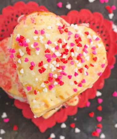 These Mini Strawberry Heart Pies are the perfect dessert for spoiling your sweetie on Valentine's Day or for entertaining those party guests. A pre-made pie crust is cut into the shape of hearts and then filled with sweet strawberry jam. It's an impressive treat that looks time-consuming but is so easy to make!