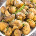 These Roasted Mushrooms with Garlic and Rosemary are loaded with a savory mixture of herbs and then baked until golden. Fast, fresh and easy to make, these mushrooms take less than 30 minutes from start to finish!