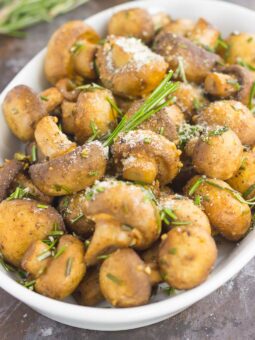 These Roasted Mushrooms with Garlic and Rosemary are loaded with a savory mixture of herbs and then baked until golden. Fast, fresh and easy to make, these mushrooms take less than 30 minutes from start to finish!