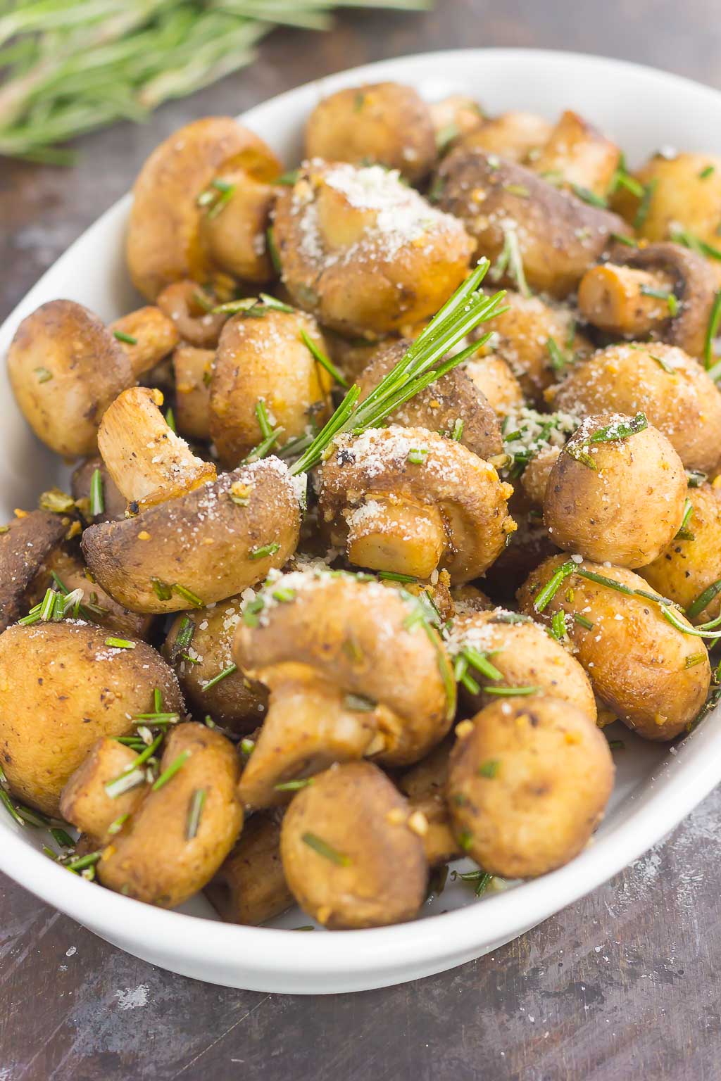 These Roasted Mushrooms with Garlic and Rosemary are loaded with a savory mixture of herbs and then baked until golden. Fast, fresh and easy to make, these mushrooms take less than 30 minutes from start to finish!