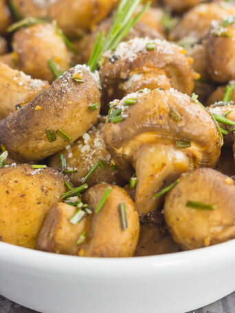 These Roasted Mushrooms with Garlic and Rosemary are loaded with a savory mixture of herbs and then baked until golden. Fast, fresh and easy to make, these mushrooms take less than 30 minutes from start to finish!