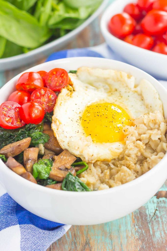 Switch up your breakfast routine with this Savory Oatmeal Breakfast Bowl. Filled with hearty oats, fresh mushrooms, sautéed spinach and an egg, this simple dish is packed with flavor and is the perfect way to start the day! #oatmeal #savoryoatmeal #oatmealrecipe #oatmealbowl #breakfastbowl #breakfast