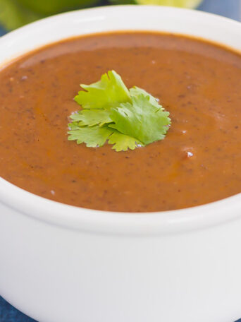 This Easy Black Bean Soup is zesty, filling, and ready in just 30 minutes. Loaded with black beans, spices, and lots of flavor, this simple soup serves as a hearty main dish and is perfect for a meatless entree!