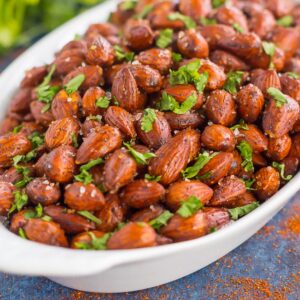 These Easy Chili Almonds are a simple snack that's packed with deliciousness. Roasted in a skillet and tossed with zesty flavors, these almonds are perfect for those snack cravings!