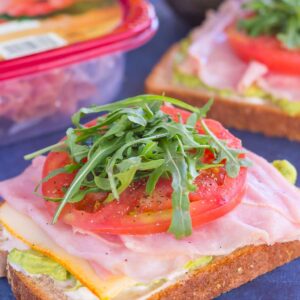 This Ham and Avocado Open-Faced Sandwich is simple, fresh, and perfect for a light lunch or dinner. Honey ham and tangy cheese is piled high on a slice of thick bread, then garnished with mayonnaise, avocado, and fresh tomato. With just six ingredients and hardly any prep time involved, you can have this easy sandwich ready in no time!