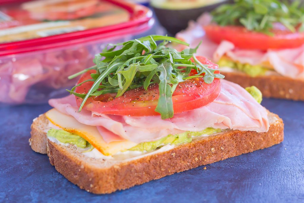 side view of two open faced honey baked ham sandwiches 