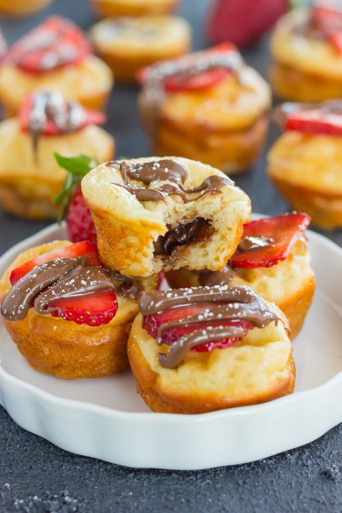 nutella stuffed pancake bites on a white plate