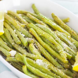 These Roasted Lemon Garlic Green Beans are a simple side dish that's packed with flavor. Crispy on the outside, tender on the inside, and loaded with a lemon garlic zest, this dish pairs perfectly with just about anything!