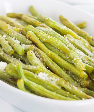 These Roasted Lemon Garlic Green Beans are a simple side dish that's packed with flavor. Crispy on the outside, tender on the inside, and loaded with a lemon garlic zest, this dish pairs perfectly with just about anything!