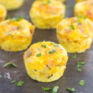 Filled with eggs, cheddar cheese, bacon, and hash browns, these Cheesy Egg and Hash Brown Cups are pop-able, and delicious for a quick breakfast on-the-go!