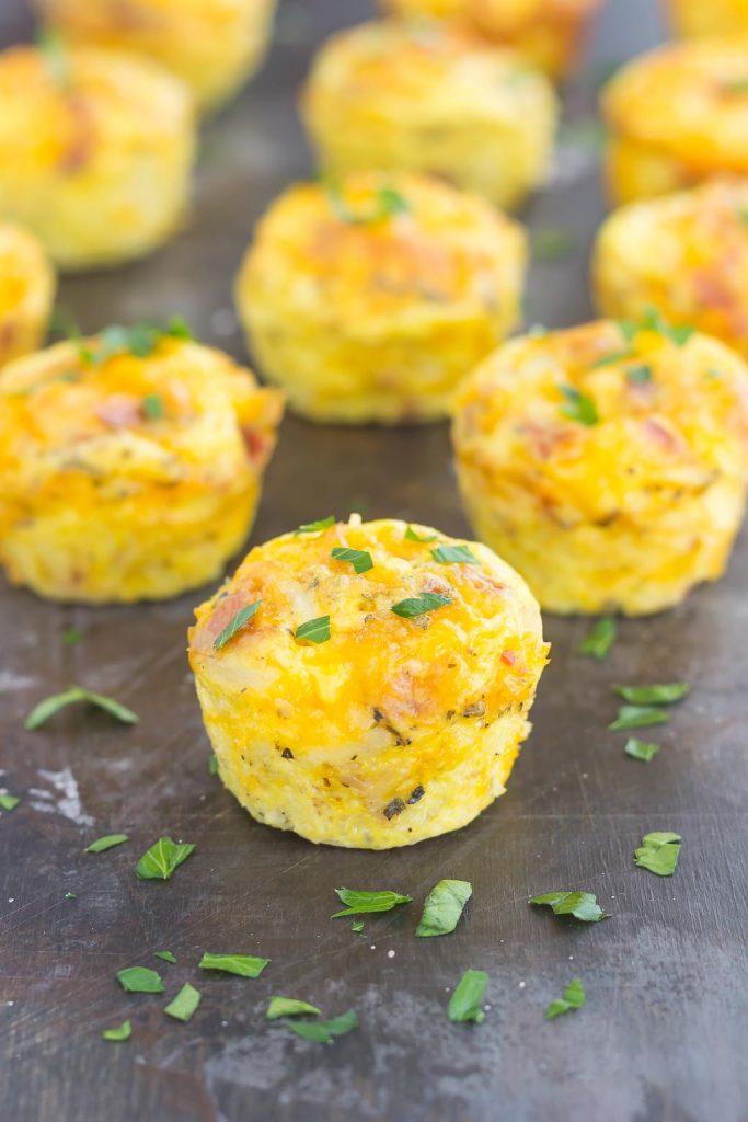 hash brown egg cups on a dark surface 