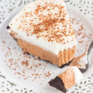 This Chocolate Nutella Cream Pie is filled with a smooth and creamy base of nutella, enveloped in a chocolate cookie crust and topped with homemade whipped cream. Easy to make and ready in no time, this decadent dessert is perfect for impressing dessert lovers everywhere!