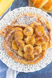 top down shot of croissant french toast with bananas on top