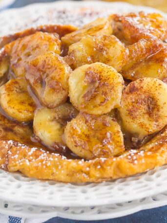 This Cinnamon Banana Croissant French Toast features thick slices of flaky, buttery croissants that are sprinkled with a cinnamon mixture and topped with caramelized bananas. Simple, fresh, and bursting with a rich flavor, this is the perfect way to switch up your french toast routine!
