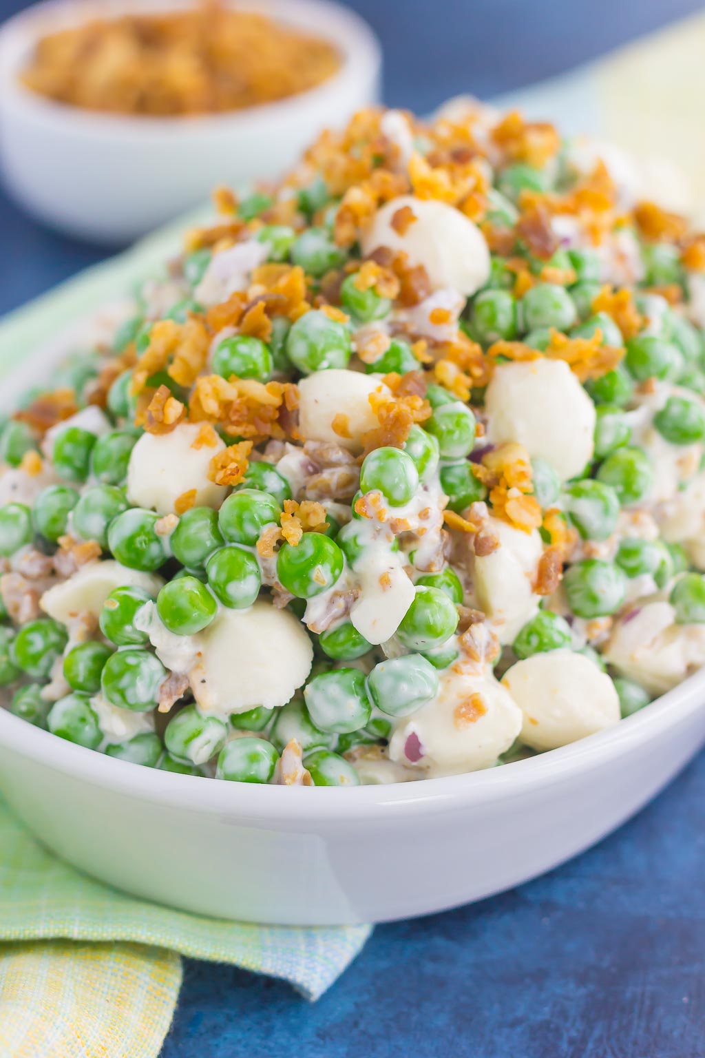 Filled with crunchy peas, feta cheese, red onion, and crumbled bacon, this Creamy Pea Salad will take your salad experience to a whole new level!