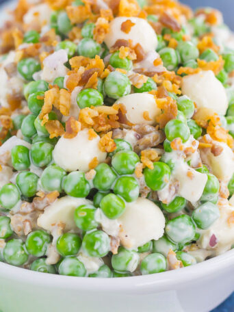 Filled with crunchy peas, feta cheese, red onion, and crumbled bacon, this Creamy Pea Salad will take your salad experience to a whole new level!