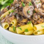 This Creamy Sausage and Mushroom Rigatoni is the perfect comfort dish that's ready in just 30 minutes. Zesty sausage, fresh mushrooms and rigatoni pasta are tossed in flavorful cream sauce. Hearty, comforting, and all-around delicious, this meal-time favorite is sure to be a winner all year long!