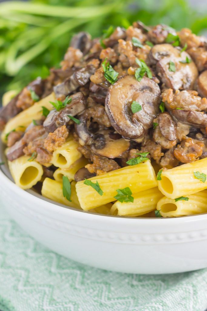 This Creamy Sausage and Mushroom Rigatoni is the perfect comfort dish that's ready in just 30 minutes. Zesty sausage, fresh mushrooms and rigatoni pasta are tossed in flavorful cream sauce. Hearty, comforting, and all-around delicious, this meal-time favorite is sure to be a winner all year long!