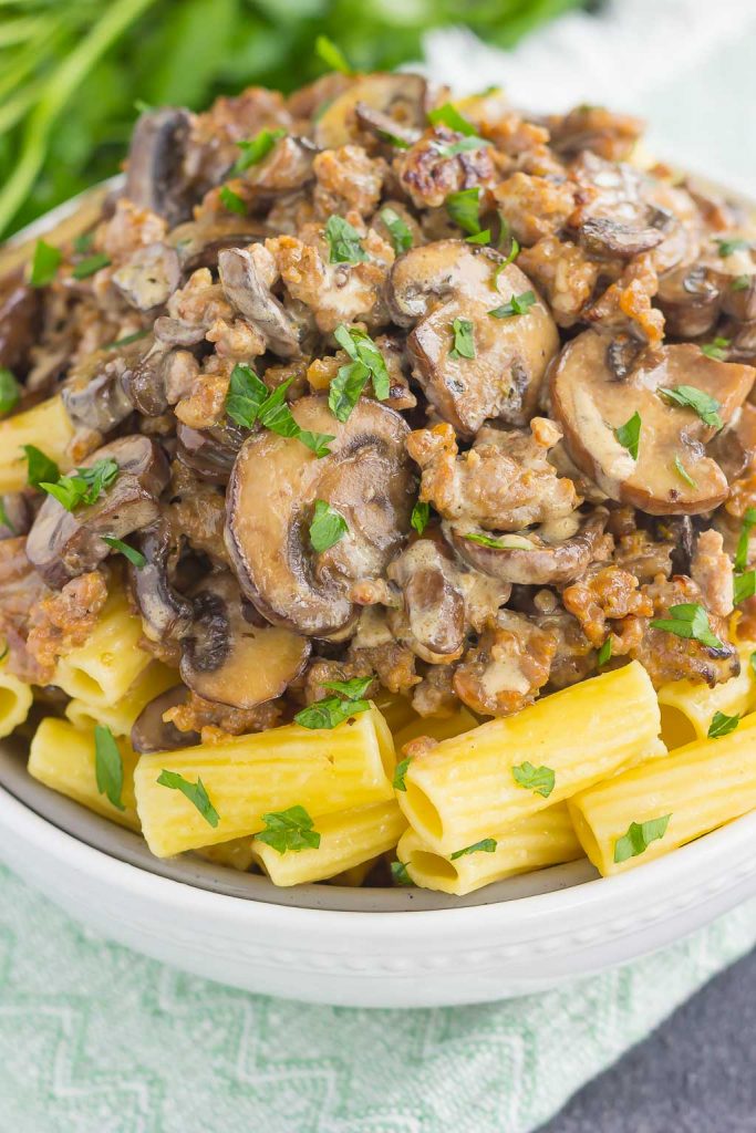 This Creamy Sausage and Mushroom Rigatoni is the perfect comfort dish that's ready in just 30 minutes. Zesty sausage, fresh mushrooms and rigatoni pasta are tossed in flavorful cream sauce. Hearty, comforting, and all-around delicious, this meal-time favorite is sure to be a winner all year long!