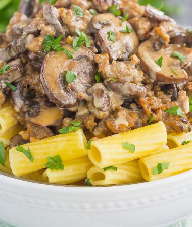This Creamy Sausage and Mushroom Rigatoni is the perfect comfort dish that's ready in just 30 minutes. Zesty sausage, fresh mushrooms and rigatoni pasta are tossed in flavorful cream sauce. Hearty, comforting, and all-around delicious, this meal-time favorite is sure to be a winner all year long!