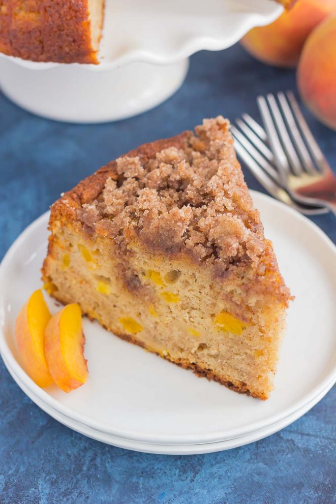 slice of peach cake on white plate