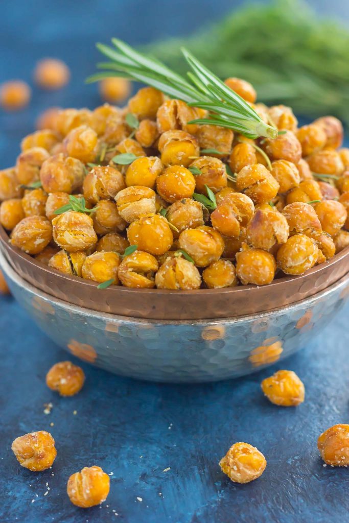 These Roasted Parmesan Herb Chickpeas are a healthy way to satisfy those snack cravings. Filled with fresh rosemary, thyme, oregano and a sprinkling of Parmesan cheese, these crunchy chickpeas are full of flavor and irresistibly delicious!
