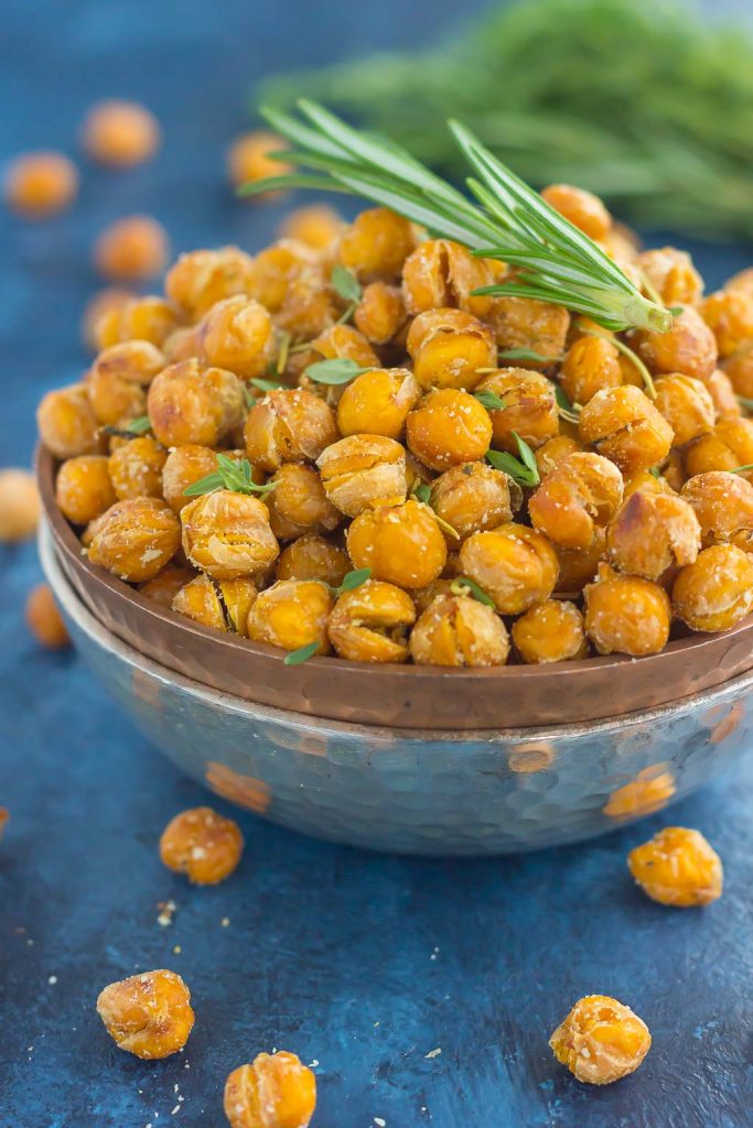 These Roasted Parmesan Herb Chickpeas are a healthy way to satisfy those snack cravings. Filled with fresh rosemary, thyme, oregano and a sprinkling of Parmesan cheese, these crunchy chickpeas are full of flavor and irresistibly delicious!