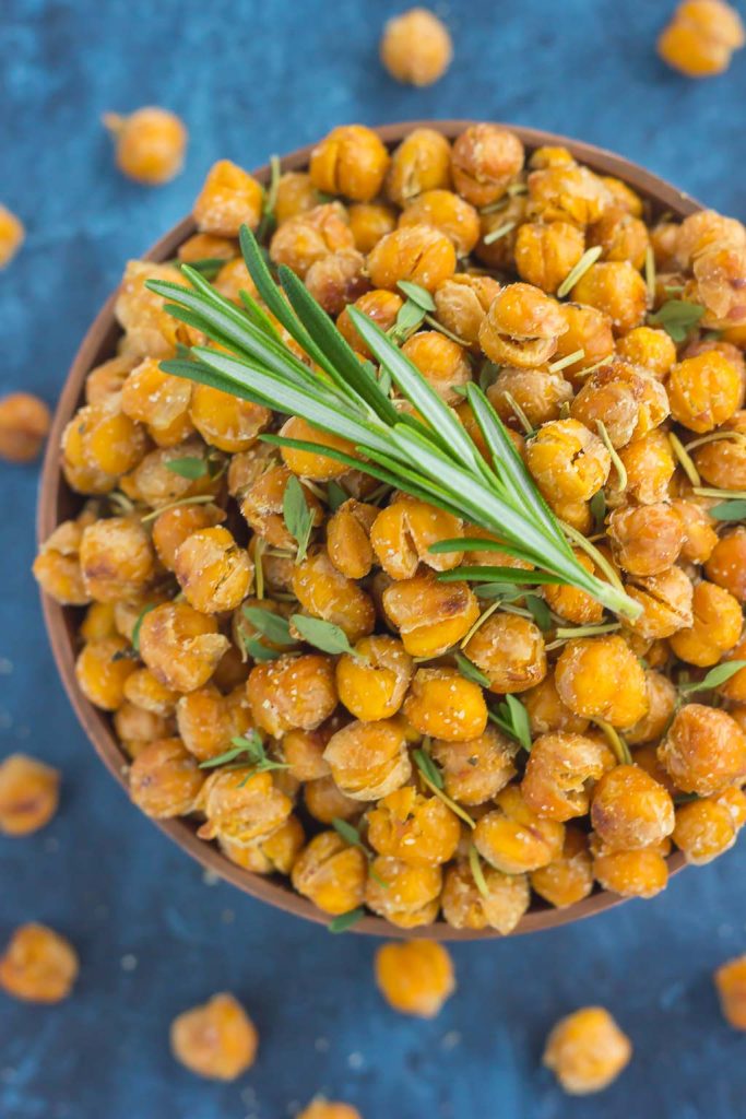 These Roasted Parmesan Herb Chickpeas are a healthy way to satisfy those snack cravings. Filled with fresh rosemary, thyme, oregano and a sprinkling of Parmesan cheese, these crunchy chickpeas are full of flavor and irresistibly delicious!