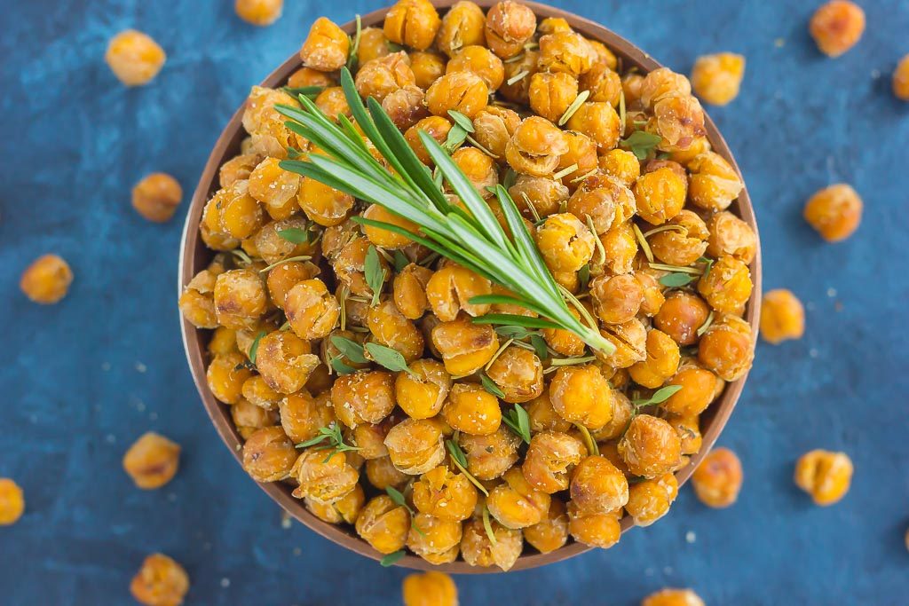 These Roasted Parmesan Herb Chickpeas are a healthy way to satisfy those snack cravings. Filled with fresh rosemary, thyme, oregano and a sprinkling of Parmesan cheese, these crunchy chickpeas are full of flavor and irresistibly delicious!