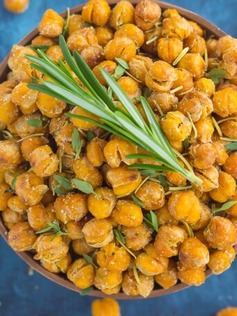 These Roasted Parmesan Herb Chickpeas are a healthy way to satisfy those snack cravings. Filled with fresh rosemary, thyme, oregano and a sprinkling of Parmesan cheese, these crunchy chickpeas are full of flavor and irresistibly delicious!