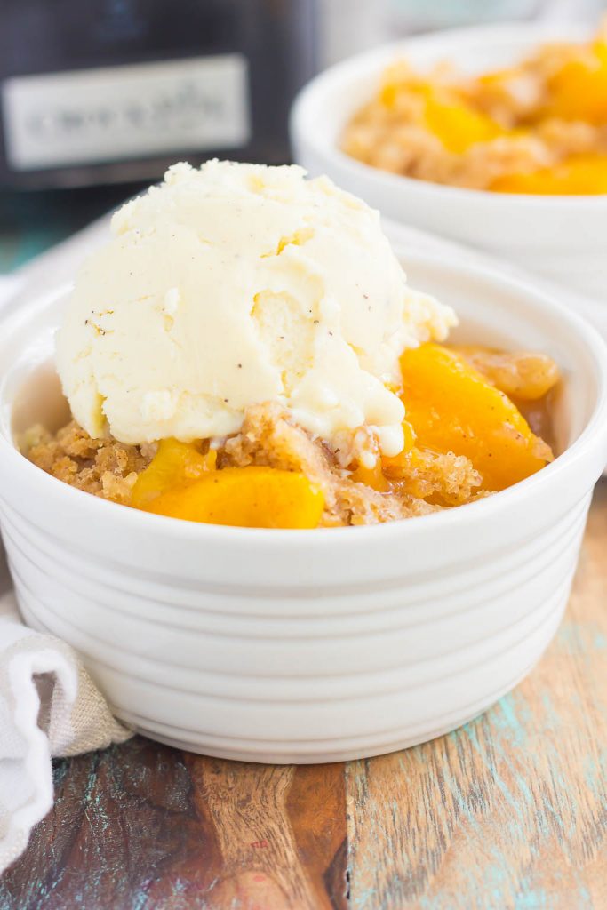 This Slow Cooker Peach Cobbler is loaded with juicy peaches, a sprinkling of cozy spices, and layered with a crispy, cakey topping. Just throw everything into the slow cooker, set it, and forget it. In just a few hours, you'll have a warm and flavorful dessert ready to be devoured!