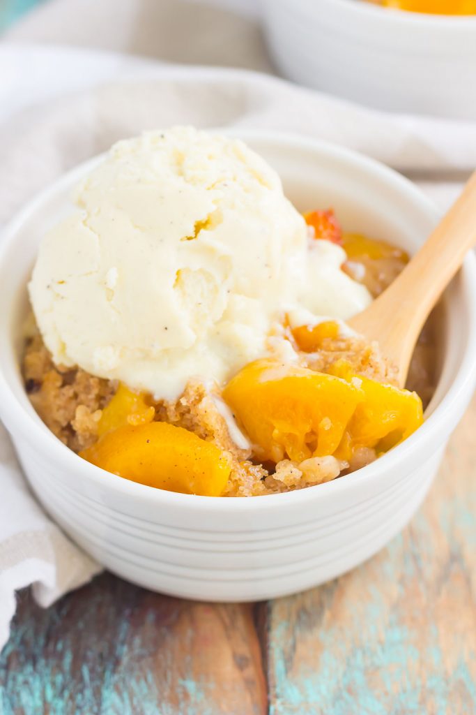 This Slow Cooker Peach Cobbler is loaded with juicy peaches, a sprinkling of cozy spices, and layered with a crispy, cakey topping. Just throw everything into the slow cooker, set it, and forget it. In just a few hours, you'll have a warm and flavorful dessert ready to be devoured!