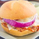 This Toasted Barbecue Chicken Sandwich is simple, fast, and the perfect meal for one! Shredded chicken is smothered with tangy barbecue sauce, then topped with Swiss cheese, red onions, and baked until melted and golden. Fresh, flavorful, and easy, you can have this meal ready in less than 15 minutes!