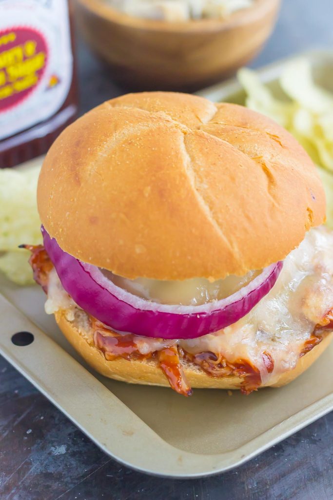 This Toasted Barbecue Chicken Sandwich is simple, fast, and the perfect meal for one! Shredded chicken is smothered with tangy barbecue sauce, then topped with Swiss cheese, red onions, and baked until melted and golden. Fresh, flavorful, and easy, you can have this meal ready in less than 15 minutes!