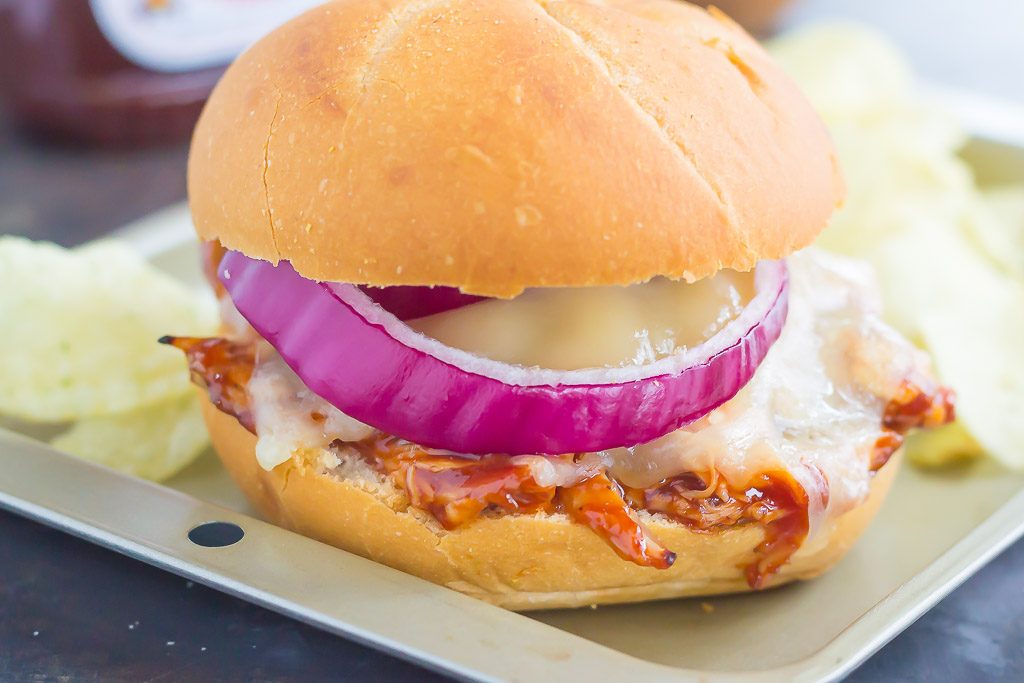 This Toasted Barbecue Chicken Sandwich is simple, fast, and the perfect meal for one! Shredded chicken is smothered with tangy barbecue sauce, then topped with Swiss cheese, red onions, and baked until melted and golden. Fresh, flavorful, and easy, you can have this meal ready in less than 15 minutes!