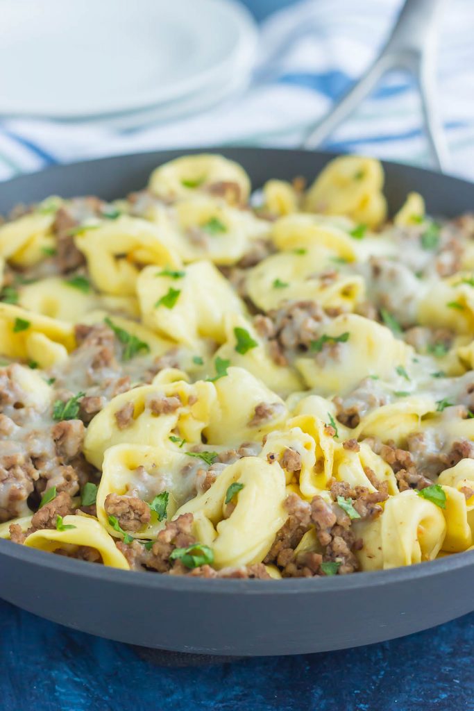 a meat tortellini skillet topped with cheese 