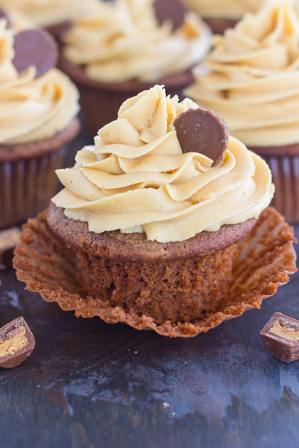 These Chocolate Cupcakes with Peanut Butter Frosting are a deliciously sweet dessert for everyone to enjoy. If you're a fan of chocolate and peanut butter, you'll love the rich and fluffy cupcakes that are piled high with a creamy and silky frosting!