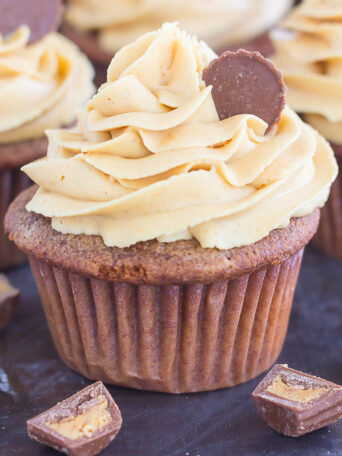 These Chocolate Cupcakes with Peanut Butter Frosting are a deliciously sweet dessert for everyone to enjoy. If you're a fan of chocolate and peanut butter, you'll love the rich and fluffy cupcakes that are piled high with a creamy and silky frosting!