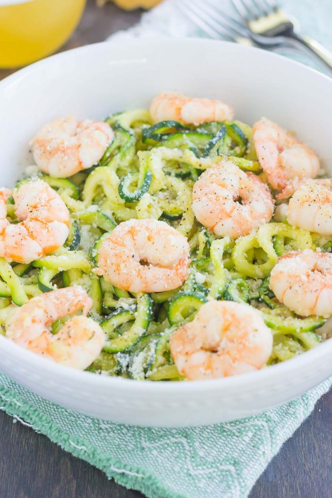 parmesan garlic shrimp zoodles in a white bowl 