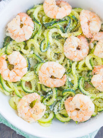 These Garlic Parmesan Zoodles with Shrimp are a healthier, one pan meal that's low carb and packed with flavor. Tender zucchini noodles are tossed with shrimp and seasoned with savory garlic and creamy Parmesan cheese. Made in one pan and ready in less than 20 minutes, this meal is perfect for busy weeknights!