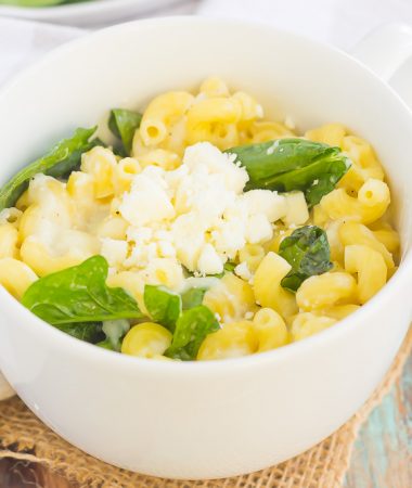 All it takes is just one mug and 5 minutes to make this Microwave Mug Spinach and Feta Macaroni and Cheese. Tender pasta, mozzarella and feta cheeses and a sprinkling of spinach create an easy, cheesy, and oh-so delicious single serving recipe for the best macaroni and cheese!