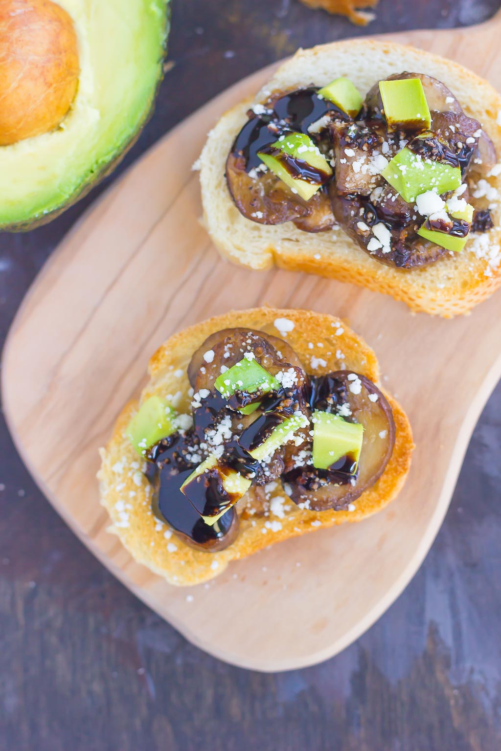 This Mushroom, Avocado and Feta Toast combines fresh mushrooms, ripe avocado and creamy feta cheese, piled high on toasted bread and drizzled with a balsamic glaze. This simple toast makes a deliciously easy appetizer or side dish!