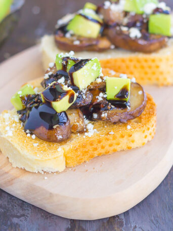 This Mushroom, Avocado and Feta Toast combines fresh mushrooms, ripe avocado and creamy feta cheese, piled high on toasted bread and drizzled with a balsamic glaze. This simple toast makes a deliciously easy appetizer or side dish!