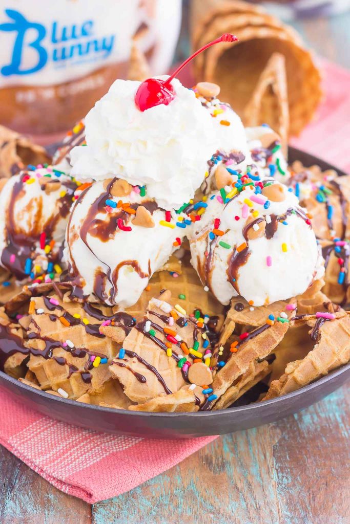 Peanut Butter Ice Cream Sundae Nachos are a deliciously sweet treat for everyone to enjoy. Crunchy waffle cones are sprinkled with sweet ice cream and all of the fun, sundae toppings. Easy to make and and even better to eat, these nachos make the best dessert during the warmer months!