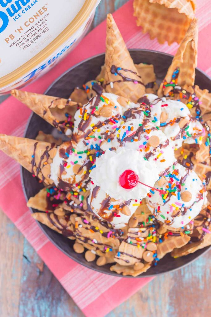 Peanut Butter Ice Cream Sundae Nachos are a deliciously sweet treat for everyone to enjoy. Crunchy waffle cones are sprinkled with sweet ice cream and all of the fun, sundae toppings. Easy to make and and even better to eat, these nachos make the best dessert during the warmer months!