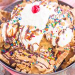 Peanut Butter Ice Cream Sundae Nachos are a deliciously sweet treat for everyone to enjoy. Crunchy waffle cones are sprinkled with sweet ice cream and all of the fun, sundae toppings. Easy to make and and even better to eat, these nachos make the best dessert during the warmer months!